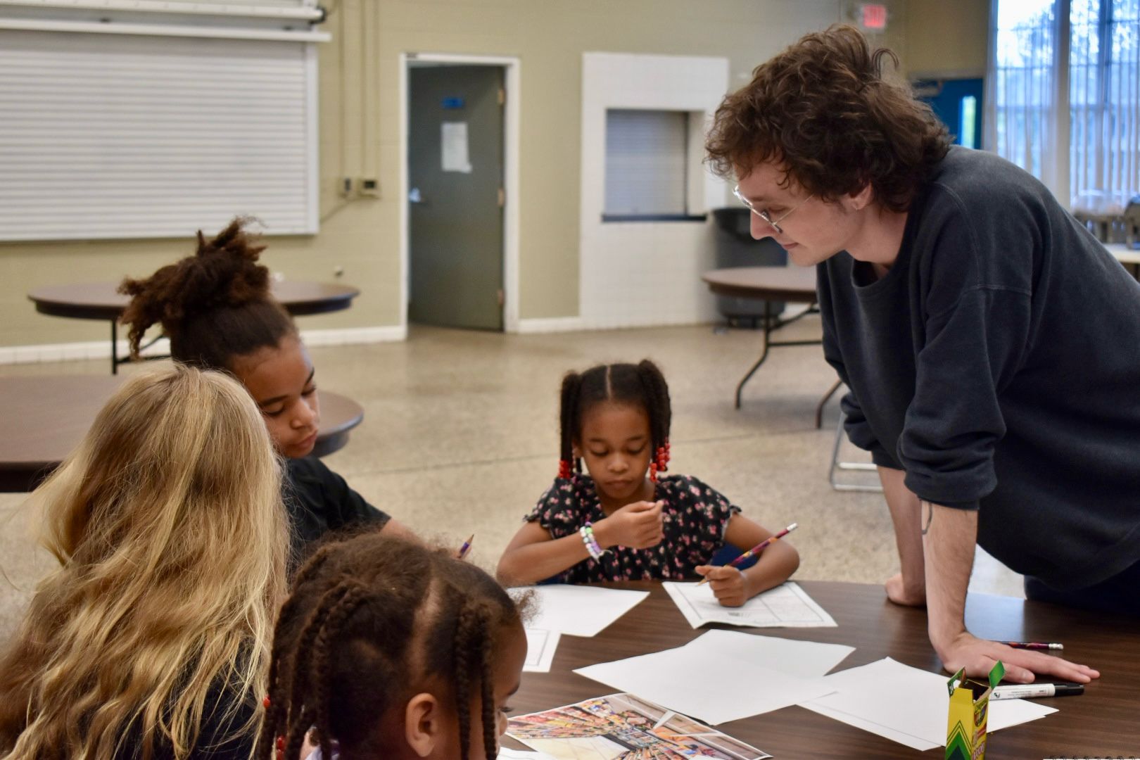 Creative Writing director Braedyn Wasden with students